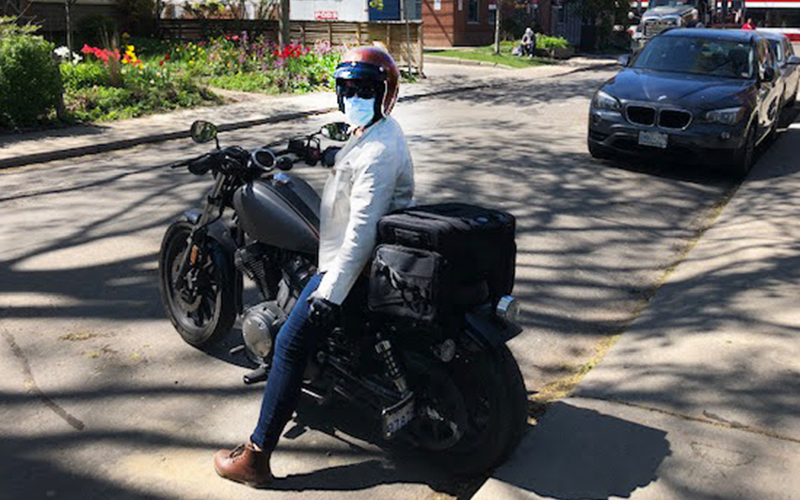 Mobile vaccine volunteer on a motorbike